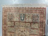 an old rug with a picture of a woman on it