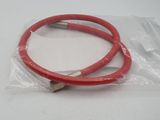 a close up of a pair of red hoses on a white surface