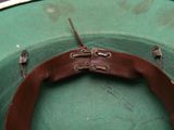 a green hat with a brown belt on it