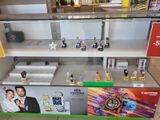 a display case with a lot of perfumes on it