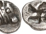 a close up of a coin with an image of a man on it