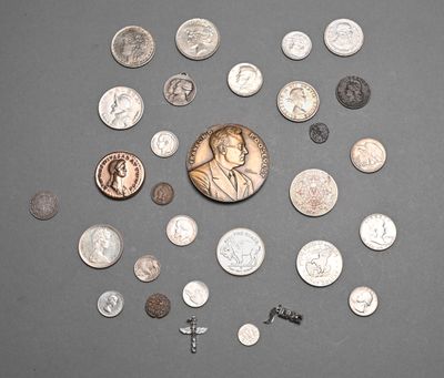 a lot of coins and a penny on a table