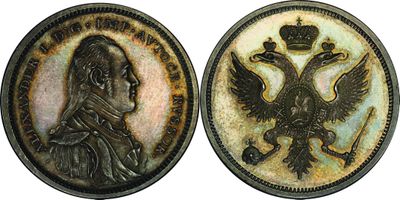 two pieces of silver coin with a picture of a man and a bird