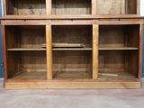 a large wooden bookcase with many shelves on it