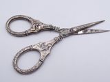 a pair of scissors that are sitting on a table