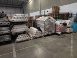 a large amount of boxes and pallets in a warehouse