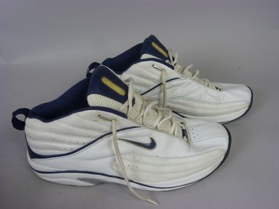 pair of white and blue sneakers with laces on them