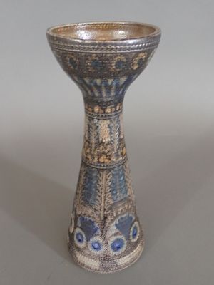 a blue and white vase sitting on a table