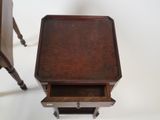 a small wooden table with a drawer underneath it