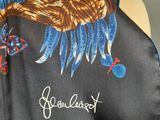 a scarf with a picture of a woman on it on a mannequin