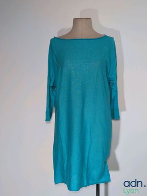 the back of a dress on a mannequin stand