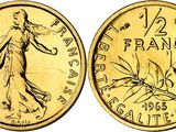 a gold coin with the image of a woman on it