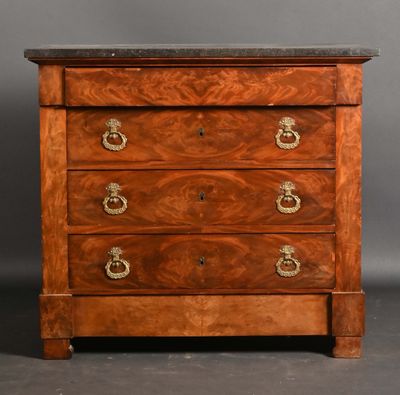 an antique chest of drawers with a marble top