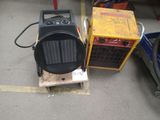 un petit radiateur posé à côté d'un autre petit radiateur dans un garage