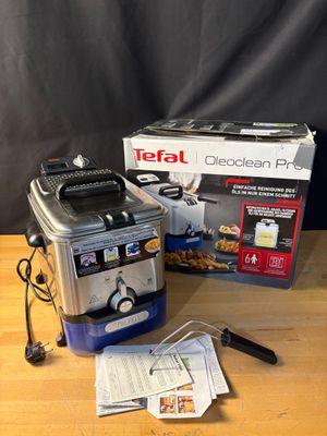 a box of food sitting on a table next to a blender
