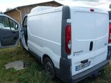 a van that is parked in the grass with its door open