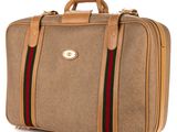 an image of a brown briefcase with a green and red stripe