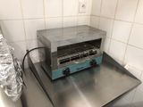 a toaster oven sitting on a counter in a kitchen