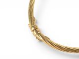 an image of a close up of a gold bracelet on a white background