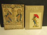deux livres posés sur une table, à côté d'un tableau représentant un homme tenant un parapluie