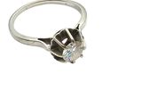 an image of a ring with a diamond in it on a white background