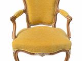 a yellow chair on a white background with a white background