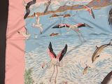 a lot of birds that are flying over the water