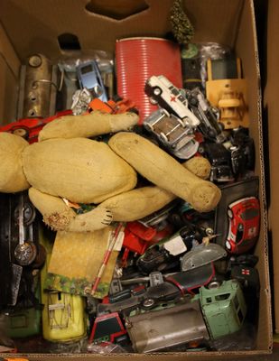 a box full of assorted toy cars and a teddy bear