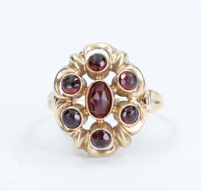 an image of a gold ring with garnets and garnets on it