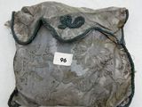 a small bag with a tag on it on a white surface