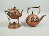 pair of antique copper teapots with handles and handles