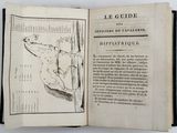 an open book with a drawing of a man on a horse