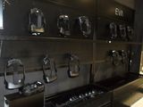 a picture of a wall of cell phones in a store