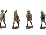 three figurines of men in military uniforms are posed on a white surface