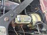 a close up of a car ' s engine with the hood open