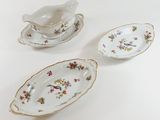 three pieces of porcelain dishes on a white surface
