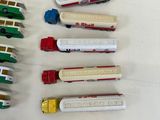 many different types of toy trains on the table