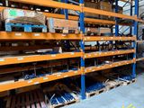 a large rack with lots of tools on it in a warehouse