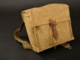 messenger bag made of canvas and leather on a black background