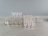 a lot of glasses that are sitting on the table