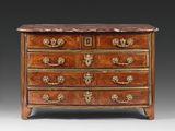 an antique chest of drawers with marble top and brass handles