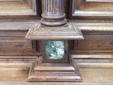 a mirror in the middle of a wooden door