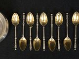 a lot of spoons and a bowl on a table