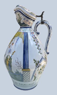a blue and white vase with a bird on it