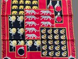 an image of a red and black scarf with elephants and leopards on it