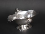 an antique silver plated bowl with a bird on top