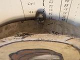 a picture of a painting on the wall above a sink