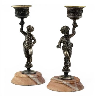 pair of antique bronze candlesticks on marble bases