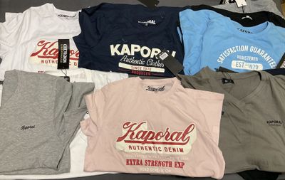 a lot of t - shirts that are on a table