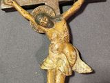 a statue of jesus on a cross on a table